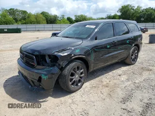 2016 Dodge Durango R/T with VIN 1C4SDHCT9GC415957, listed as a Copart auction lot 53565115 with 144,412 mi miles and Salvage title. Bid and sale history available at DreamBid. Image 1.