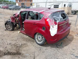 2014 Ford Fiesta Titanium z VIN 3FADP4FJ7EM204194, wystawiony jako IAAI lot #42314274 z przebiegiem 173 088 mil mil oraz . Historia ofert i sprzedaży dostępna na DreamBid. Obrazek 3.