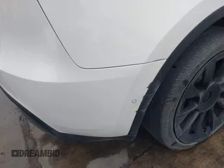 2022 Tesla Model Y Long Range z VIN 7SAYGDEE2NF420882, wystawiony jako IAAI lot #42023642 z przebiegiem 19 783 mil mil oraz . Historia ofert i sprzedaży dostępna na DreamBid. Obrazek 19.