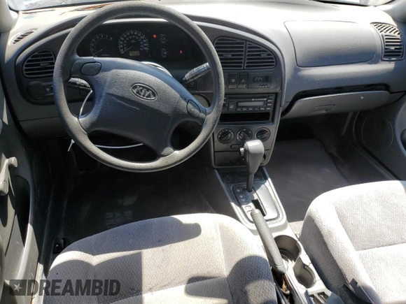 2004 Kia Spectra GS with VIN KNAFB161945141309, listed as a Copart auction lot 52395445 with 99,100 mi miles and Clean Title. Bid and sale history available at DreamBid. Image 8.