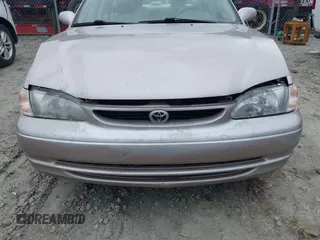 1998 Toyota Corolla VE z VIN 2T1BR18EXWC015480, wystawiony jako IAAI lot #41959316 z przebiegiem 224 304 mil mil oraz . Historia ofert i sprzedaży dostępna na DreamBid. Obrazek 6.