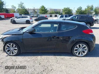 2013 Hyundai Veloster w/Gray Int with VIN KMHTC6AD4DU131242, listed as a IAAI auction lot 42074517 with 76,713 mi miles and . Bid and sale history available at DreamBid. Image 14.
