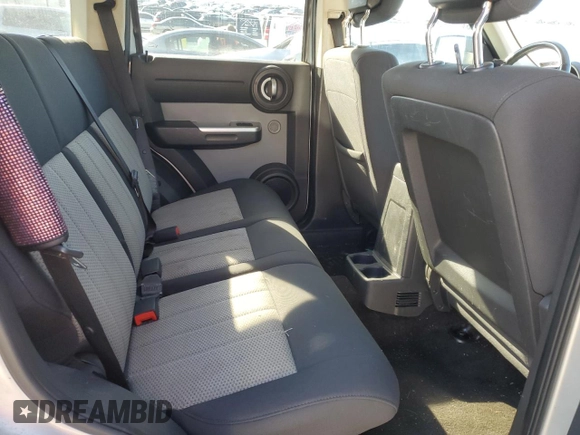 2010 Dodge Nitro SXT z VIN 1D4PT5GKXAW108802, wystawiony jako Copart lot #80215434 z przebiegiem 225 908 mil mil oraz Szkody całkowita. Historia ofert i sprzedaży dostępna na DreamBid. Obrazek 11.