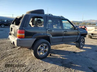 1998 Jeep Grand Cherokee Laredo with VIN 1J4FX58S4WC102623, listed as a Copart auction lot 86188764 with 283,210 mi miles and Salvage Title. Bid and sale history available at carsss.com. Image 3.