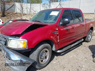 2003 Ford F-150 XLT with VIN 1FTRW07L13KD81923, listed as a IAAI auction lot 42112168 with 147,039 mi miles. Bid and sale history available at carsss.com. Image 2.