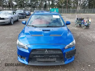 2015 Mitsubishi Lancer Evolution GSR with VIN JA32W8FV4FU012578, listed as a IAAI auction lot 41730742 with 64,762 mi miles. Bid and sale history available at carsss.com. Image 13.