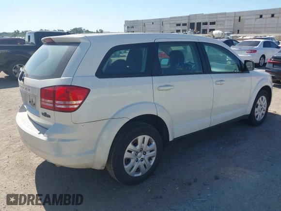 2014 Dodge Journey SE with VIN 3C4PDCAB2ET258681, listed as a IAAI auction lot 42558132 with 136,569 mi miles and . Bid and sale history available at DreamBid. Image 4.