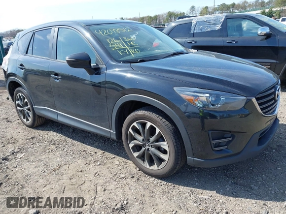 2016 Mazda CX-5 Grand Touring with VIN JM3KE4DY8G0639570, listed as a IAAI auction lot 42098512 with 126,541 mi miles and . Bid and sale history available at carsss.com. Image 1.