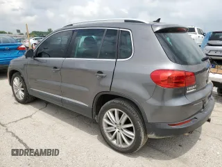 2012 Volkswagen Tiguan SE z VIN WVGAV7AX4CW001417, wystawiony jako Copart lot #61105865 z przebiegiem 168 110 mil mil oraz Czysty tytuł • Clean title. Historia ofert i sprzedaży dostępna na DreamBid. Obrazek 2.