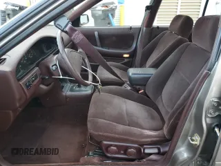 1990 Nissan Maxima z VIN JN1HJ01P3LT393901, wystawiony jako Copart lot #79912694 z przebiegiem 127 678 mil mil oraz Szkody całkowita. Historia ofert i sprzedaży dostępna na DreamBid. Obrazek 7.