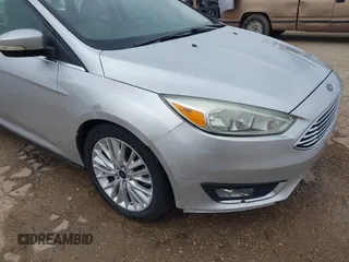 2017 Ford Focus Titanium with VIN 1FADP3J24HL229702, listed as a IAAI auction lot 42057013 with 120,250 mi miles and . Bid and sale history available at DreamBid. Image 17.