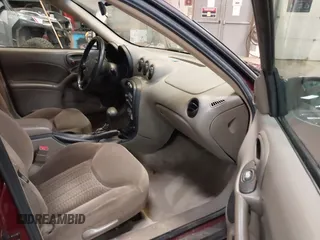2002 Pontiac Grand Am SE z VIN 1G2NE52F92C291335, wystawiony jako IAAI lot #41665150 z przebiegiem 75 552 mil mil oraz . Historia ofert i sprzedaży dostępna na DreamBid. Obrazek 5.