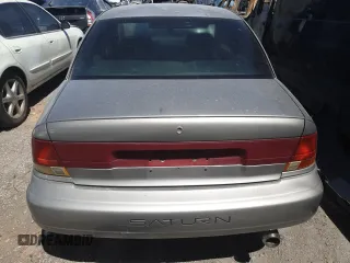 1999 Saturn SL z VIN 1G8ZK5271XZ316032, wystawiony jako Copart lot #50663015 z przebiegiem 164 288 mil mil oraz Nie do naprawy. Historia ofert i sprzedaży dostępna na DreamBid. Obrazek 6.
