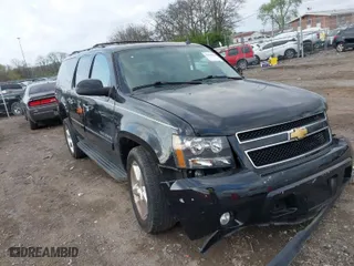 2013 Chevrolet Suburban LT with VIN 1GNSKJE70DR284785, listed as a IAAI auction lot 41838484 with 113,696 mi miles. Bid and sale history available at carsss.com. Image 1.