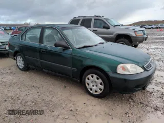 2000 Honda Civic LX with VIN 2HGEJ6676YH512977, listed as a Copart auction lot 50985455 with 242,759 mi miles and Salvage Title. Bid and sale history available at DreamBid. Image 4.