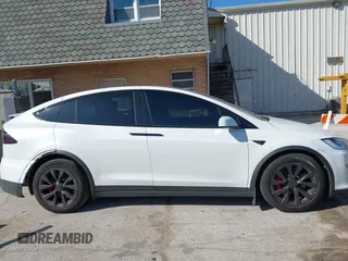 2023 Tesla Model X Plaid with VIN 7SAXCBE63PF405105, listed as a IAAI auction lot 41876918 with 22,475 mi miles and . Bid and sale history available at DreamBid. Image 14.