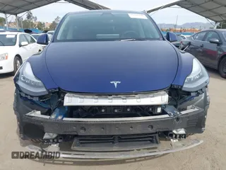 2022 Tesla Model Y Long Range with VIN 7SAYGDEE0NA019067, listed as a IAAI auction lot 41645198 with 49,336 mi miles and . Bid and sale history available at DreamBid. Image 13.