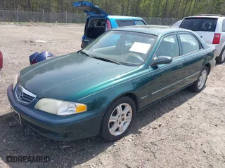 2001 Mazda 626 LX with VIN 1YVGF22D915241384, listed as a IAAI auction lot 41927705 with 231,801 mi miles. Bid and sale history available at carsss.com. Image 2.