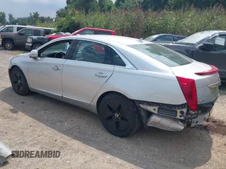 2014 Cadillac XTS Luxury z VIN 2G61N5S38E9270619, wystawiony jako IAAI lot #40140617 z przebiegiem 117 286 mil mil oraz . Historia ofert i sprzedaży dostępna na DreamBid. Obrazek 3.