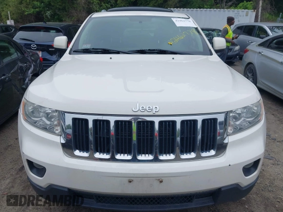 2011 Jeep Grand Cherokee Laredo with VIN 1J4RR4GG0BC670506, listed as a IAAI auction lot 42462778 with 241,406 mi miles and . Bid and sale history available at DreamBid. Image 6.