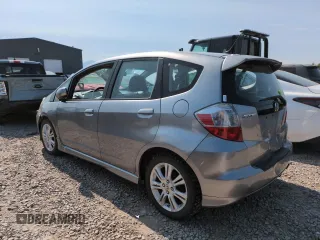 2010 Honda Fit Sport with VIN JHMGE8H41AC002070, listed as a Copart auction lot 62356565 with 148,279 mi miles and Salvage title. Bid and sale history available at DreamBid. Image 2.