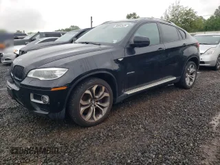 2013 BMW X6 xDrive50i z VIN 5UXFG8C55DL591991, wystawiony jako Copart lot #58042525 z przebiegiem 144 370 mil mil oraz Tytuł czysty. Historia ofert i sprzedaży dostępna na DreamBid. Obrazek 1.