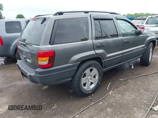 2003 Jeep Grand Cherokee Laredo z VIN 1J4GW48S73C545863, wystawiony jako IAAI lot #42222247 z przebiegiem 128 529 mil mil oraz . Historia ofert i sprzedaży dostępna na DreamBid. Obrazek 4.