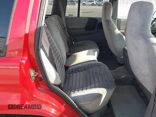 1995 Jeep Grand Cherokee Laredo with VIN 1J4FX58S9SC686074, listed as a IAAI auction lot 42451786 with 82,249 mi miles and . Bid and sale history available at DreamBid. Image 8.