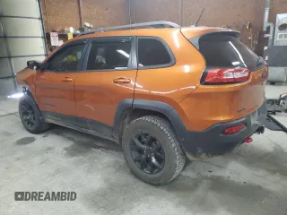 2014 Jeep Cherokee Trailhawk with VIN 1C4PJMBS0EW308775, listed as a Copart auction lot 60465125 with 117,326 mi miles and Salvage title. Bid and sale history available at DreamBid. Image 2.