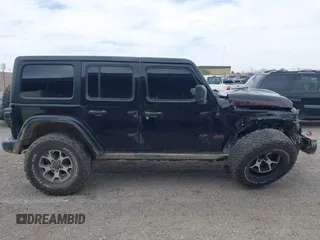 2022 Jeep Wrangler Unlimited Rubicon with VIN 1C4HJXFN2NW134024, listed as a IAAI auction lot 42248188 with 41,899 mi miles and . Bid and sale history available at DreamBid. Image 13.
