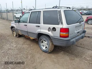 1995 Jeep Grand Cherokee Laredo with VIN 1J4GZ58S4SC532578, listed as a IAAI auction lot 41936041 with 161,777 mi miles. Bid and sale history available at carsss.com. Image 3.
