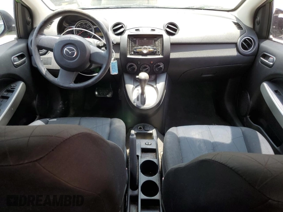 2012 Mazda 2 Sport with VIN JM1DE1KZ5C0141784, listed as a Copart auction lot 56498295 with 132,602 mi miles and Salvage Title. Bid and sale history available at DreamBid. Image 8.