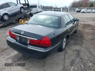 2005 Mercury Grand Marquis LS Premium z VIN 2MEFM75W65X671622, wystawiony jako IAAI lot #41958287 z przebiegiem 154 662 mil mil oraz . Historia ofert i sprzedaży dostępna na DreamBid. Obrazek 4.