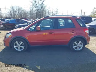 2009 Suzuki SX4 Man Touring Pkg AWD with VIN JS2YB417496201691, listed as a IAAI auction lot 41741746 with 172,369 mi miles. Bid and sale history available at carsss.com. Image 14.