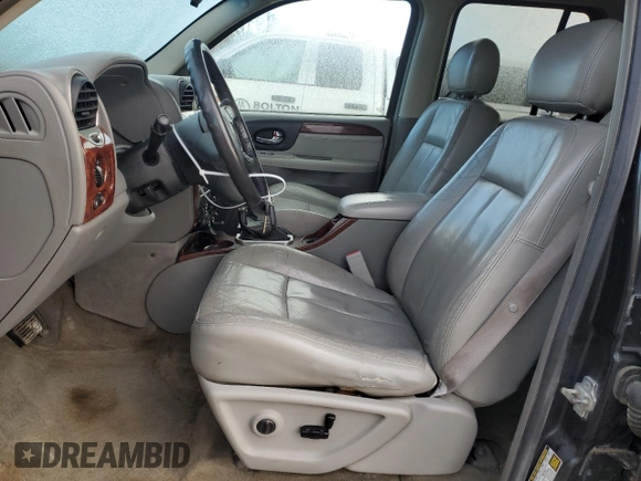 2005 GMC Envoy SLT with VIN 1GKDT13S552310799, listed as a Copart auction lot 43586125 with 182,928 mi miles and Salvage Title. Bid and sale history available at carsss.com. Image 7.