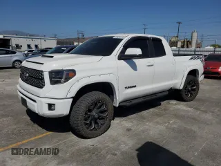 2014 Toyota Tundra SR with VIN 5TFUM5F14EX057285, listed as a Copart auction lot 61629115 with 129,463 mi miles and Salvage title. Bid and sale history available at DreamBid. Image 1.