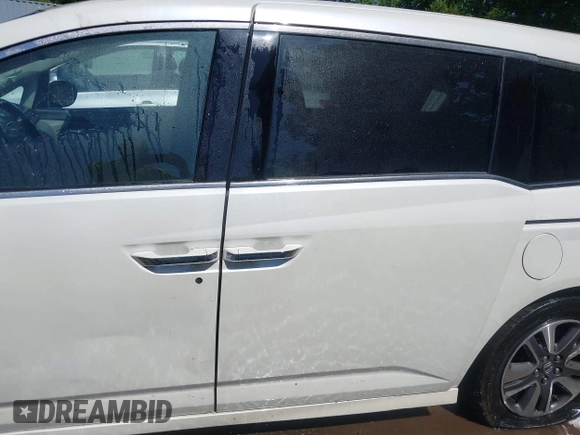 2014 Honda Odyssey Touring with VIN 5FNRL5H94EB071788, listed as a IAAI auction lot 42523959 with 244,734 mi miles and . Bid and sale history available at DreamBid. Image 14.