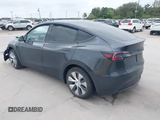 2024 Tesla Model Y with VIN 7SAYGDED3RF002246, listed as a IAAI auction lot 41566184 with 10,316 mi miles and . Bid and sale history available at DreamBid. Image 3.