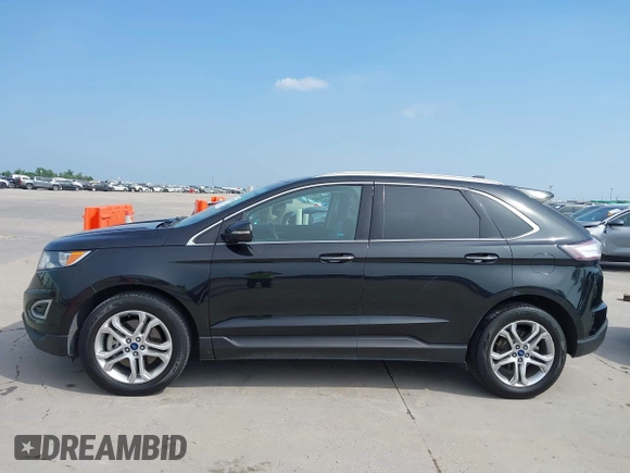 2015 Ford Edge Titanium z VIN 2FMTK3K87FBC06852, wystawiony jako IAAI lot #42335238 z przebiegiem 187 256 mil mil oraz . Historia ofert i sprzedaży dostępna na DreamBid. Obrazek 14.