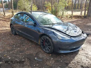 2022 Tesla Model 3 Performance with VIN 5YJ3E1EC5NF270082, listed as a IAAI auction lot 40930688 with Not Provided miles. Bid and sale history available at carsss.com. Image 1.