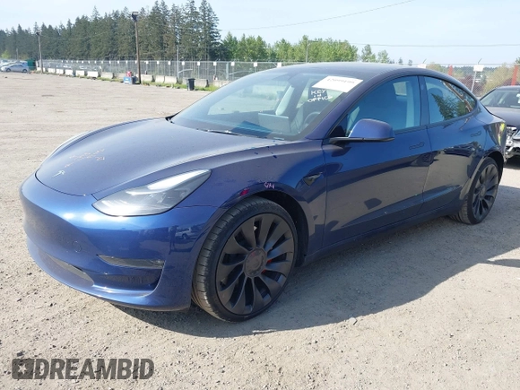 2023 Tesla Model 3 Performance with VIN 5YJ3E1EC2PF679613, listed as a IAAI auction lot 42099199 with 21,721 mi miles. Bid and sale history available at carsss.com. Image 2.