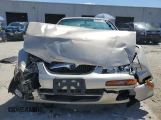 2000 Mazda Millenia with VIN JM1TA2210Y1614967, listed as a Copart auction lot 53606185 with 120,288 mi miles and Salvage Title. Bid and sale history available at DreamBid. Image 5.