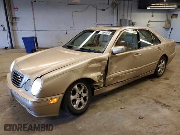 2002 Mercedes-Benz E-Class with VIN WDBJF65J12B485293, listed as a Copart auction lot 77561984 with 140,708 mi miles and Salvage Title. Bid and sale history available at carsss.com. Image 1.