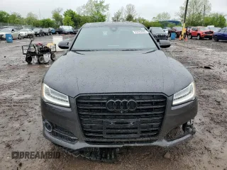 2017 Audi A8 z VIN WAU44AFD0HN004258, wystawiony jako Copart lot #55283985 z przebiegiem 128 059 mil mil oraz Szkoda całkowita • Salvage title. Historia ofert i sprzedaży dostępna na DreamBid. Obrazek 5.