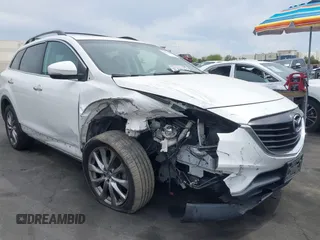 2015 Mazda CX-9 Grand Touring z VIN JM3TB2DV9F0458340, wystawiony jako IAAI lot #42021843 z przebiegiem 145 929 mil mil oraz . Historia ofert i sprzedaży dostępna na DreamBid. Obrazek 1.
