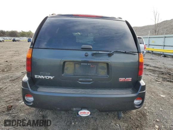 2004 GMC Envoy SLT z VIN 1GKDT13S042406662, wystawiony jako Copart lot #50523855 z przebiegiem 62 122 mil mil oraz Czysty tytuł • Clean title. Historia ofert i sprzedaży dostępna na DreamBid. Obrazek 6.