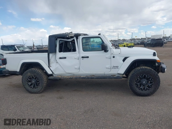 2021 Jeep Gladiator High Altitude with VIN 1C6HJTFG2ML567988, listed as a IAAI auction lot 42103576 with 74,849 mi miles and . Bid and sale history available at DreamBid. Image 13.