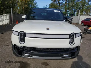 2024 Rivian R1S Adventure z VIN 7PDSGABAXRN035766, wystawiony jako Copart lot #77481034 z przebiegiem 6 590 mil mil oraz Szkoda całkowita • Salvage title. Historia ofert i sprzedaży dostępna na DreamBid. Obrazek 5.