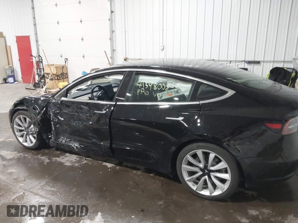 2018 Tesla Model 3 Long Range Battery with VIN 5YJ3E1EB7JF086778, listed as a IAAI auction lot 41348008 with 74,491 mi miles and . Bid and sale history available at DreamBid. Image 6.