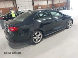 2015 Volkswagen Jetta Sedan 2.0T GLI SE with VIN 3VW5T7AJ0FM275867, listed as a IAAI auction lot 42133491 with 98,718 mi miles. Bid and sale history available at carsss.com. Image 4.